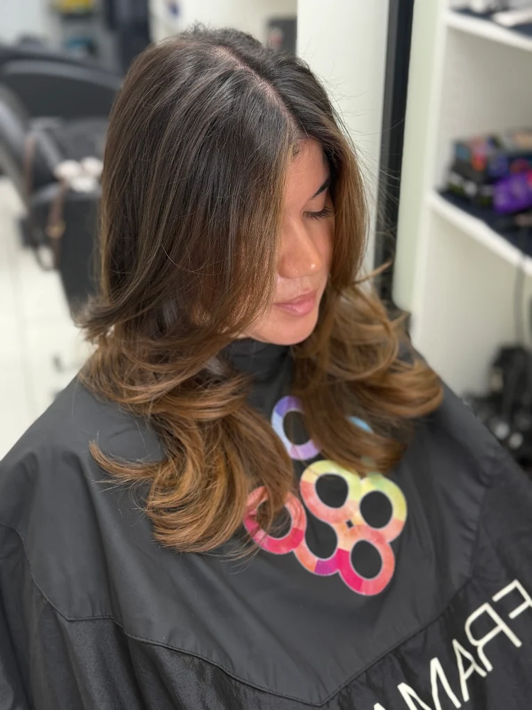 Face framing brunette layered haircut and blowout in Surrey BC