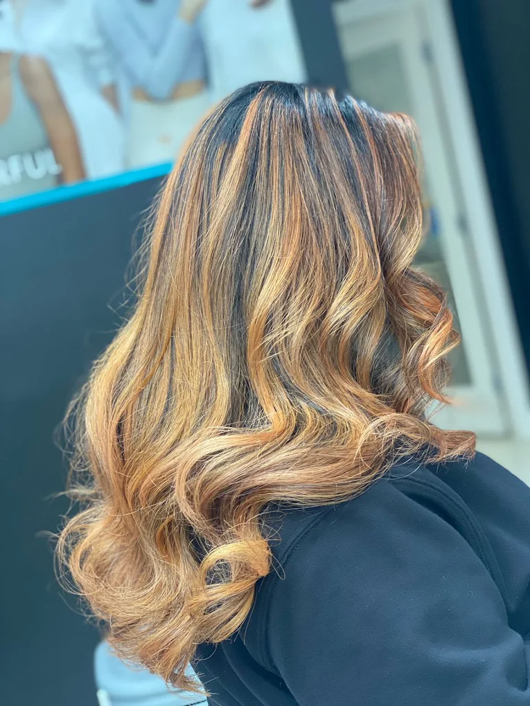 Golden caramel balayage with soft curls created by Lux Hair & Skin Lounge in Surrey BC