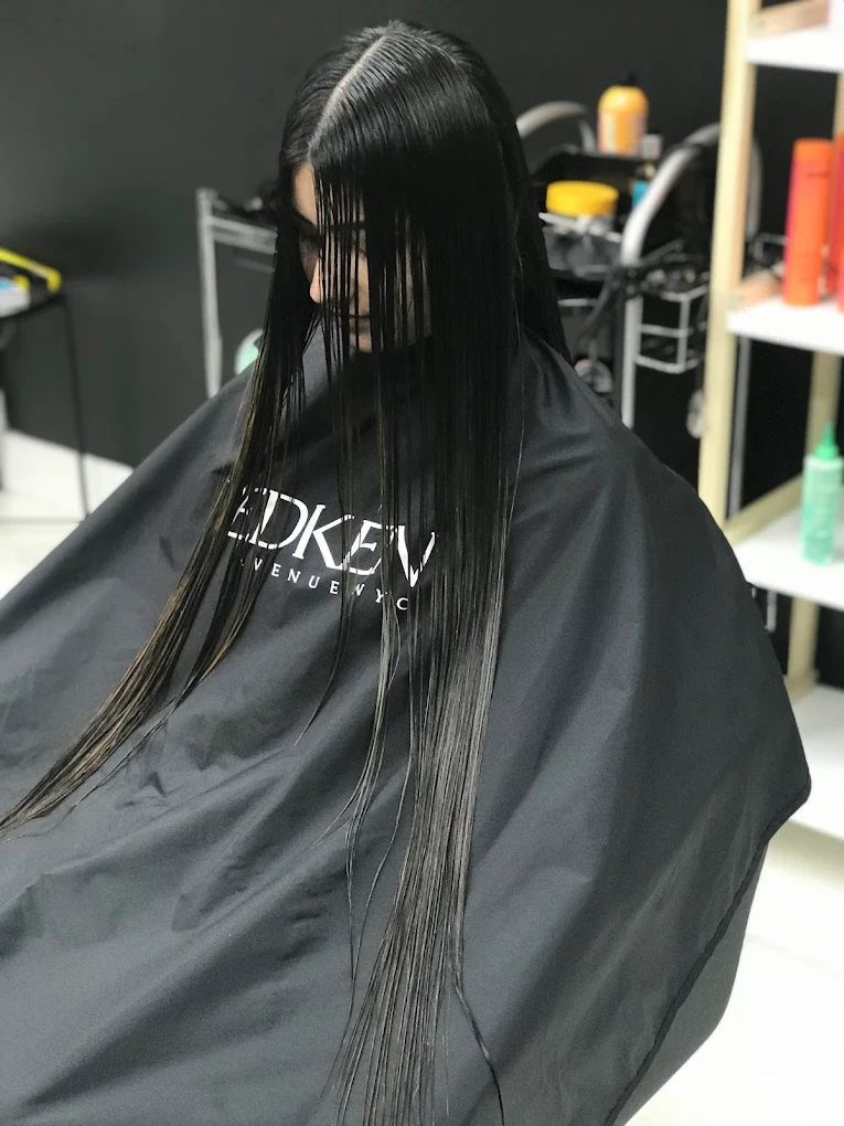 Long sleek straight glossy hair finish at Lux women only salon in Surrey BC