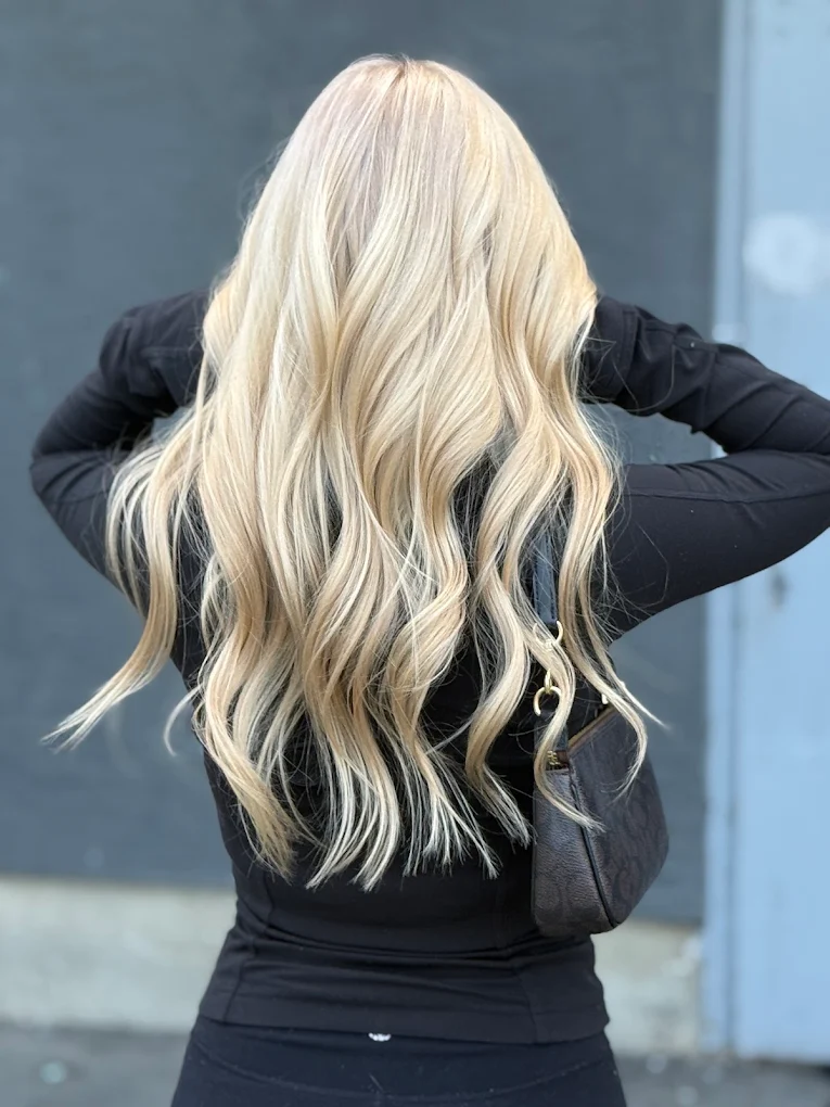 Platinum blonde hair colour with long soft waves created in Surrey BC