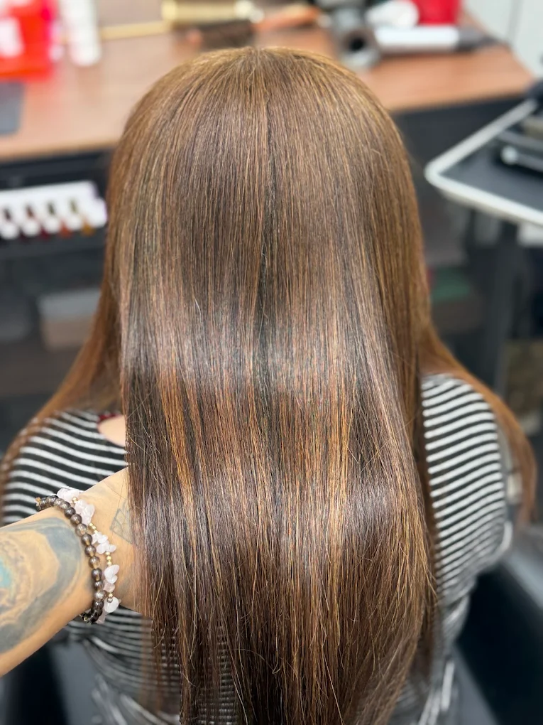 Smooth glossy brunette hair finish created at Lux women only salon Surrey